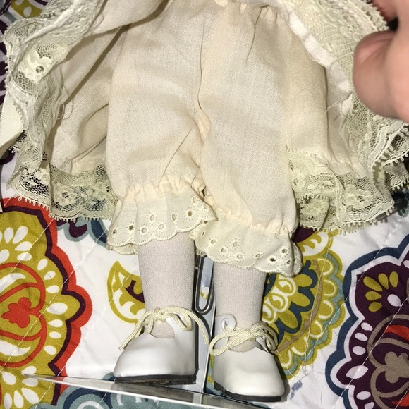 Elegant Cream Porcelain Doll with Brown Hair - Picture 3 of 7